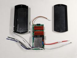 Open Ceiling Fan Remote Control Open smart ceiling fan remote control with internal components exposed.