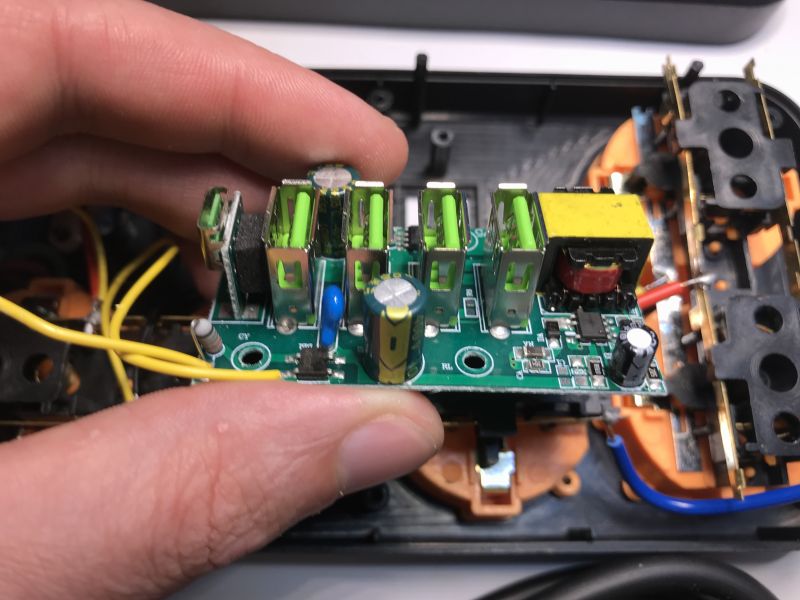 USB charger PCB with five ports and electronic components inside power strip