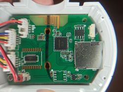 Close-up photograph of the interior of an electronic device showing the XF16 chipset.