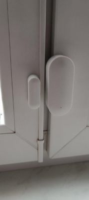 Sensor mounted on the interior window frame.