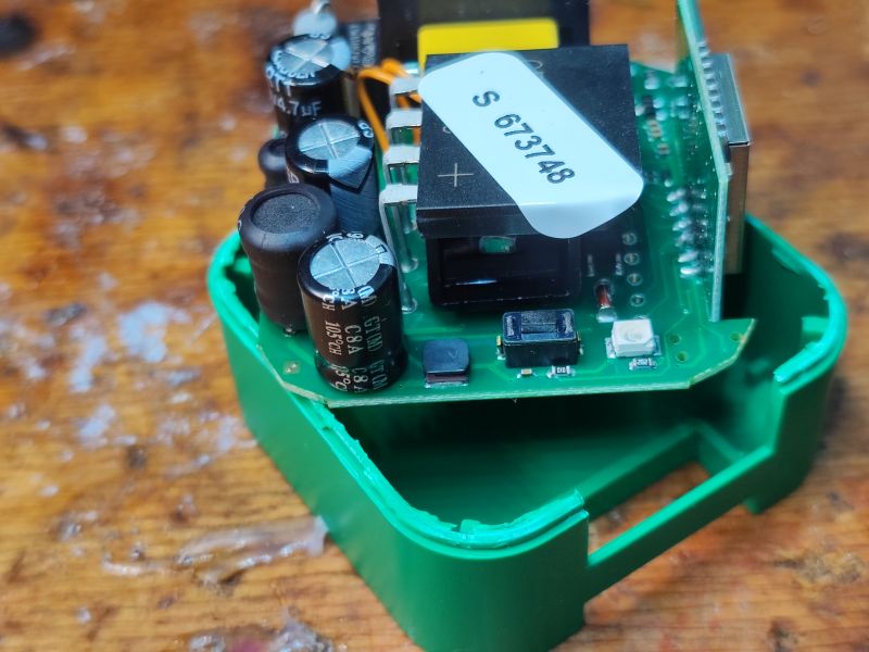 Interior of a Dimmer with Polish Software Electronic components inside a green dimmer housing.