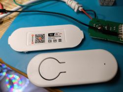 WiFi LED Controller with Open Case View of a WiFi LED controller with the cover removed, showing the circuit board with various components.