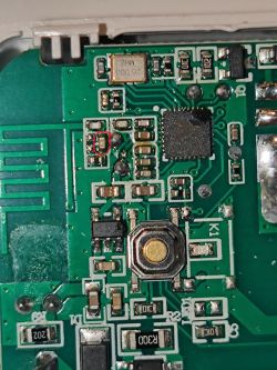 Image of a printed circuit board with a red circle marking the spot where an SMD component is missing.