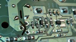 Close-up of a circuit board with visible capacitors and resistors.