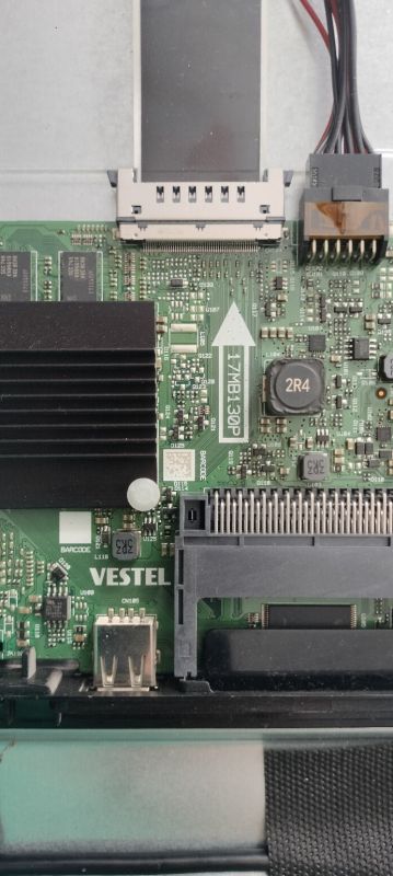 Close-up of a Vestel PCB with heatsink, ribbon connectors, and marking 17MB130P