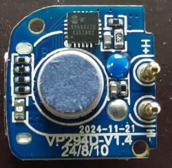 Electronic module with various components on a blue PCB.