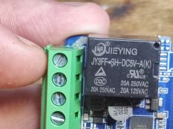Close-up of JIEYING JY3FF-SH-DC5V-A(K) relay on blue PCB