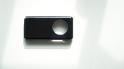 Black USB flash drive casing with a hole.