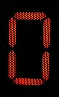 Red digit “0” formed by LED dots in a seven-segment display style