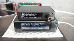 Two black internet radio players with LCD displays showing missing Polish diacritical characters.