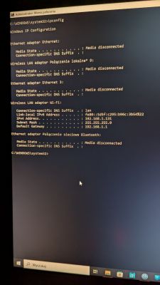 Zrzut ekranu ipconfig z przypisanym adresem IP 192.168.1.131 przez Wi-Fi