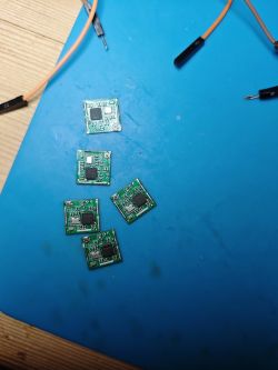 Electronic circuit boards on a blue mat.