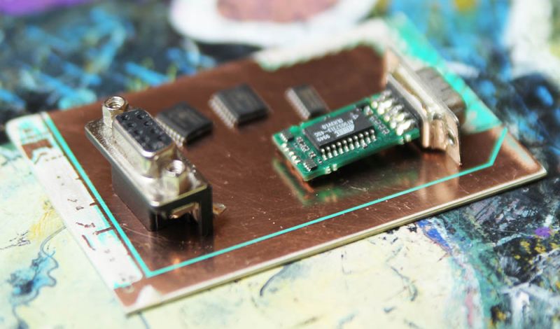 PCB with electronic components on a colorful background.