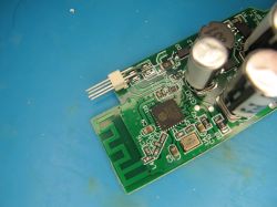 Close-up of PCB with antenna and electronic components Printed circuit board with capacitors, a chip, and an integrated PCB antenna