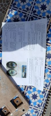 Instruction sheet on a tiled table.