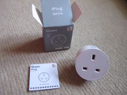 Sonoff S60TPG iPlug UK Smart Plug Set Sonoff S60TPG iPlug smart plug, manual, and Type G box on a carpet.