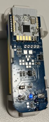 Close-up of the CBU-NL electronic module with visible connectors and components on the circuit board.