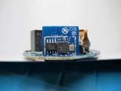 View of disassembled Teckin SP23 module with PCB marking HYS-01-127_V1.1 visible.