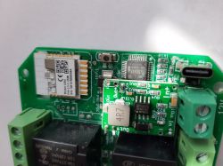 Close-up of a green circuit board with various electronic components.
