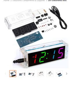 DIY LED clock kit with clear acrylic case, PCB board, and a multicolor display reading 12:15