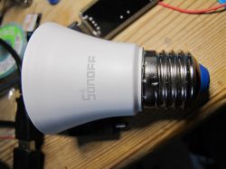 Sonoff B02-BL-A60 LED bulb lying on a tabletop.