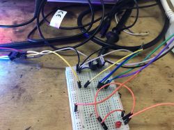 LED Connection to Breadboard Close-up of a breadboard with multicolored wires and electronic components connected.