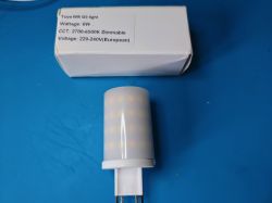 Smart LED Bulb Tuya G9 Smart LED bulb Tuya G9 and its box on a blue surface.