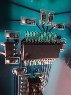 Close-up of a circuit board with an integrated circuit and resistors.