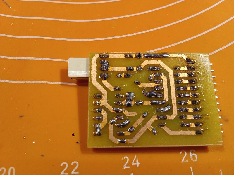 Circuit board showing copper traces and soldering.