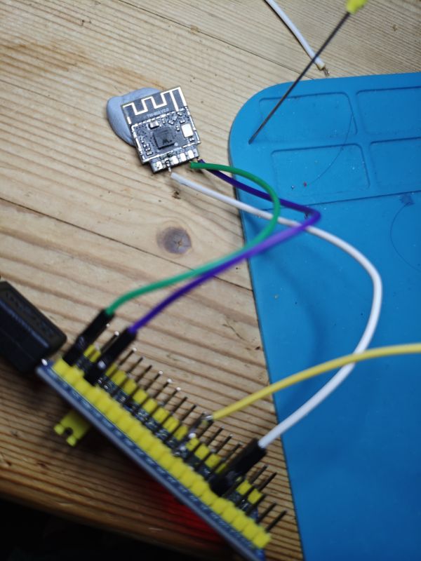 Module with PCB antenna wired to STM32 board, needle touching one pin