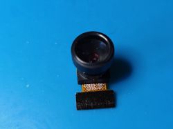 Mini Camera with Fisheye Lens on FFC Ribbon Mini camera module with fisheye lens and FFC ribbon cable on a blue background.