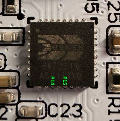 Close-up of an IC on a PCB with visible markings C23 and green labels P14 and P15