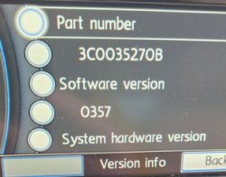 Car infotainment system display showing part number and software version information.