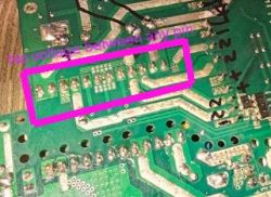 Close-up of a circuit board with a pink rectangle highlighting and the text no voltage between pins.
