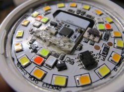 Interior of an LED bulb with visible diodes and electronic components.
