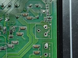 Close-up of circuit board with FET and diode labels Close-up of green PCB with labels “HI VOLT FET” and “HI VOLT DIODE”
