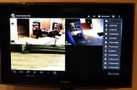 How can I stream footage from a camera at work to my TV at home via the internet?