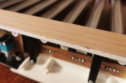 Close-up of corner with wood veneer applied to 3D-printed PLA enclosure