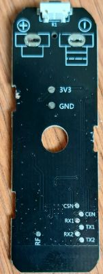 Printed circuit board with connector, labeled terminals and tracks, top view.
