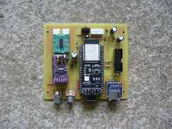 Assembled PCB with ESP32 module and various electronic components