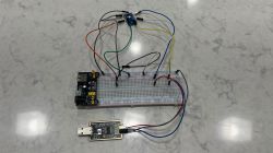 Prototyping Circuit with Breadboard and USB Adapter Electronic circuit on a breadboard with connected wires, modules, and a USB adapter.