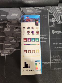 AliExpress Smart Bulb Packaging Packaging of a smart bulb from AliExpress against a world map background.