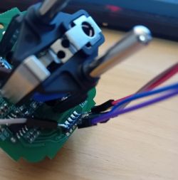 Interior of a Smart Plug with Soldered Wires Close-up of the interior of a smart plug with several wires soldered to the pins on the PCB.