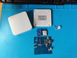 Disassembled Smart Gateway with WBR3 modules on a blue mat.