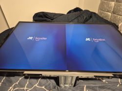 JVC TV with dual logos on the screen.