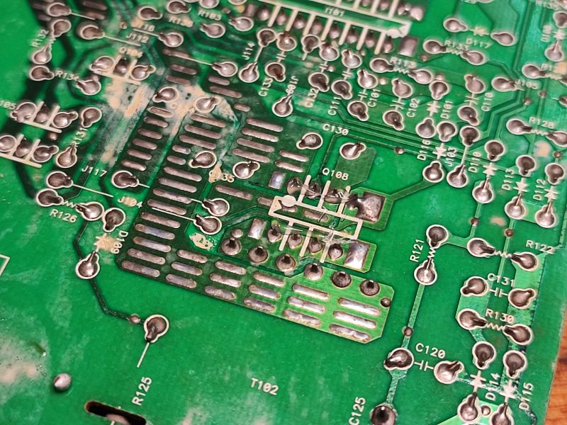 Old circuit board with soldered components Close-up of an old circuit board with soldered electronic components