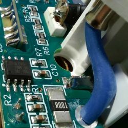 Interior of a Disassembled Smart Plug Interior of a smart plug with visible integrated circuits and wires.