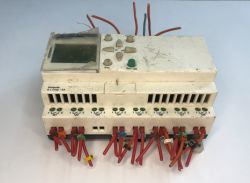 The interior of an old Schneider Electric SR1 A201BD programmable logic controller