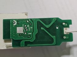 Close-up of a circuit board with markings such as TX, RX, EN, and GND.