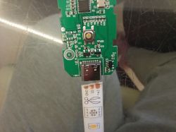 Close-up of a circuit board with a USB-C port and a LED strip labeled GND, 24V, and Dout.